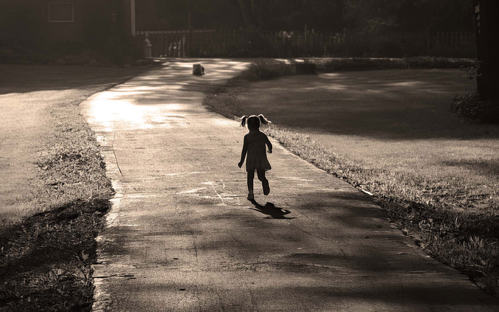 Girl running in driveway